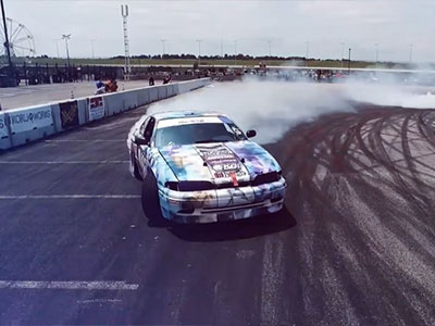 Image of a car drifting on a race track